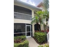 Two story exterior elevation with a screened in entry way and screened in balcony at 7201 L Pavia Blvd # 7201, Venice, FL 34292