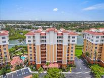 Stunning building view, showing landscaping, pool, and boat dock at 157 Tampa E Ave # 305, Venice, FL 34285