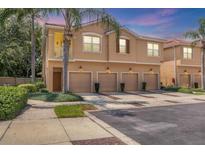 Charming townhome with a private garage and a cozy balcony surrounded by lush landscaping at 3633 Parkridge Cir # 10-201, Sarasota, FL 34243