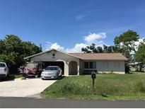 Charming single-story home with a well-manicured lawn and covered entry, offering curb appeal at 3661 Sterling Rd, Venice, FL 34293