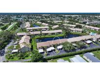 Lovely condo community with ponds, landscaping, and convenient carports, near the beach at 330 Mission N Trl # F, Venice, FL 34285