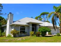 Charming single-story home with well-maintained landscaping, a gray roof, and a traditional architectural style at 505 Duke Rd, Venice, FL 34293