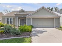 Charming single-story home featuring a well-maintained front yard and an attached two-car garage at 511 Wexford Dr, Venice, FL 34293