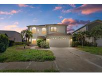 Charming two-story home with a well-manicured lawn and attached two car garage at 9528 Knightsbridge Cir, Sarasota, FL 34238