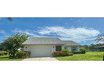 Charming single-story home featuring a two-car garage and a well-maintained lawn at 112 Woodingham Dr, Venice, FL 34292