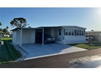 Well-maintained single Gathering home with covered parking at 411 Vasto Dr, Venice, FL 34285