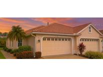 Charming one-story home featuring a two-car garage and beautifully landscaped front yard at 4343 Whispering Oaks Dr, North Port, FL 34287