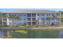 Charming three-story building with manicured landscaping and scenic water view at 700 Gardens Edge Dr # 722, Venice, FL 34285