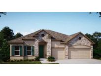 Charming single-story home with stone accents, a well-manicured lawn, a two-car garage, and an arched entry at 25497 Calusa Dr, Punta Gorda, FL 33955