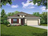 One-story home with attractive landscaping and a two-car garage at 25503 Calusa Dr, Punta Gorda, FL 33955
