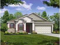 Charming single-Gathering home features a two-car garage, manicured lawn, and stone accents at 25129 Calusa Dr, Punta Gorda, FL 33955