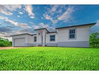 Well-manicured lawn and pleasing contemporary architecture highlight this charming single Gathering home at 15245 Brainbridge Circle, Port Charlotte, FL 33981