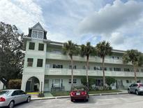 Green building exterior with parking at 2386 Sumatran Way # 26, Clearwater, FL 33763