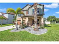 Two-story house with landscaped front yard at 8235 Bird Whistle Ln, Land O Lakes, FL 34637
