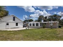 Spacious backyard with detached garage and sunroom at 1620 Lakeview Pl, Englewood, FL 34223