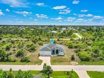 Aerial view of single-Gathering home and surrounding area at 9573 Shelburne Cir, Port Charlotte, FL 33981