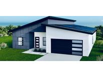 Modern home with solar panels and attached garage at 2148 Adirondack Ln, Port Charlotte, FL 33953