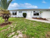 Newly renovated light blue single-story house with landscaped yard at 8188 San Jacinto Ave, North Port, FL 34287
