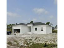 Newly constructed one-story home with attached garage at 13 Polar Ct, Placida, FL 33946