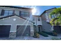 Townhouse with 2-car garage and nicely landscaped entry at 7224 Ketch Pl, Bradenton, FL 34212