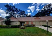 Cute two-bedroom villa with a tile roof, and nicely landscaped lawn at 3601 57Th Avenue W Dr # 31, Bradenton, FL 34210