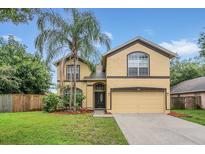 Two-story house with a two-car garage and landscaping at 1712 Scotch Pine Dr, Brandon, FL 33511