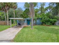 Charming bungalow with carport and manicured lawn at 7329 Royal Palm Dr, New Port Richey, FL 34652