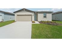 Single-story home with attached garage and landscaped front yard at 184 Lazy Shore Dr, Nokomis, FL 34275