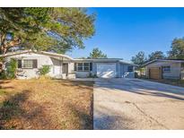 Ranch style home with attached garage and mature landscaping at 11357 116Th Ave, Largo, FL 33778