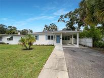 Charming one-story house with light blue door at 2585 15Th N Ave, St Petersburg, FL 33713