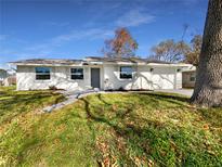 Newly renovated home with a large front yard at 290 Dragon Rd, Venice, FL 34293