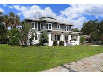 Two-story craftsman home with gray siding and white trim at 2041 Beach Dr Se, St Petersburg, FL 33705