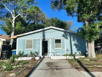 A light blue single story house with a small front yard at 112 N Betty Ln, Clearwater, FL 33755