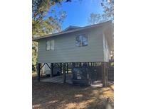 Elevated home with carport underneath at 707 George S St, Tarpon Springs, FL 34688