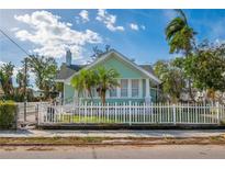 Charming light green house with white picket fence at 708 22Nd W St, Bradenton, FL 34205