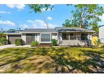 Updated ranch home with landscaped lawn and attached garage at 2809 Marlette St, Sarasota, FL 34231