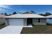 Charming single-story home featuring a two-car garage, well-maintained lawn, and modern metal roof at 12263 Cartouche Ave, Punta Gorda, FL 33955