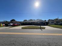 Single-story home with attached garage and driveway at 5770 46Th N Ave, Kenneth City, FL 33709