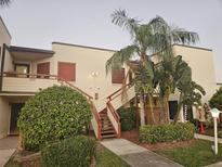 Exterior view of condo building with stairs and landscaping at 314 Spring Lakes Blvd # 314-U, Bradenton, FL 34210