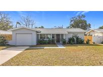 Charming ranch home with a freshly painted exterior and well-manicured lawn at 4816 12Th N Ave, St Petersburg, FL 33713