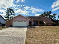 Brick ranch house with attached garage and carport at 12010 Villa Rd, Spring Hill, FL 34609