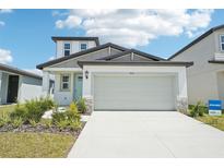 Charming two-story home featuring a two-car garage, and attractive landscaping at 3912 Radiant Mountain Dr, Plant City, FL 33565