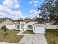 Charming single-story home featuring a well-manicured lawn and an attached one-car garage at 4604 Hunts Ave, Plant City, FL 33566