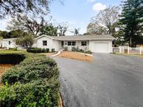 Charming single-story home with well-manicured landscaping and a paved driveway at 2642 49Th N St, St Petersburg, FL 33710