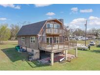 Unique barn style home featuring multi level decks and an open area underneath at 373 Hile Ln, Punta Gorda, FL 33982