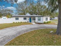 Charming single-story home with a well-manicured lawn and a circular driveway at 6800 20Th N St, St Petersburg, FL 33702