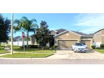 Charming single-Gathering home with a well-manicured lawn and a two-car garage on a sunny corner lot at 3709 Tristram Loop, Land O Lakes, FL 34638