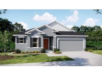 Charming single-Gathering home with a gray stucco exterior, well-manicured lawn, and a two-car garage at 51 Independence St, Port Charlotte, FL 33954