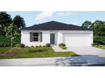 Well maintained single story home with white exterior and a nicely manicured lawn at 1317 Arrow St, Port Charlotte, FL 33952
