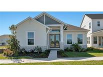 Charming single-story home featuring stone accents, a well-manicured lawn, and double door entrance at 3603 Lajuana Blvd, Wesley Chapel, FL 33543